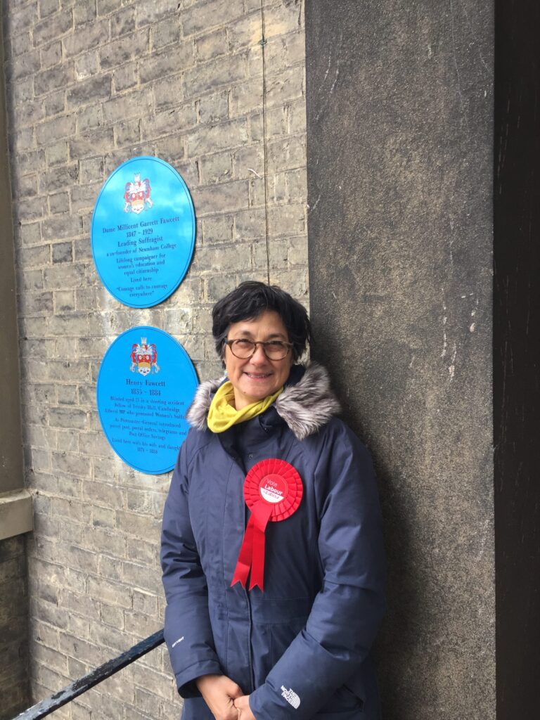 Katie next to plaque to Millicent Fawcett