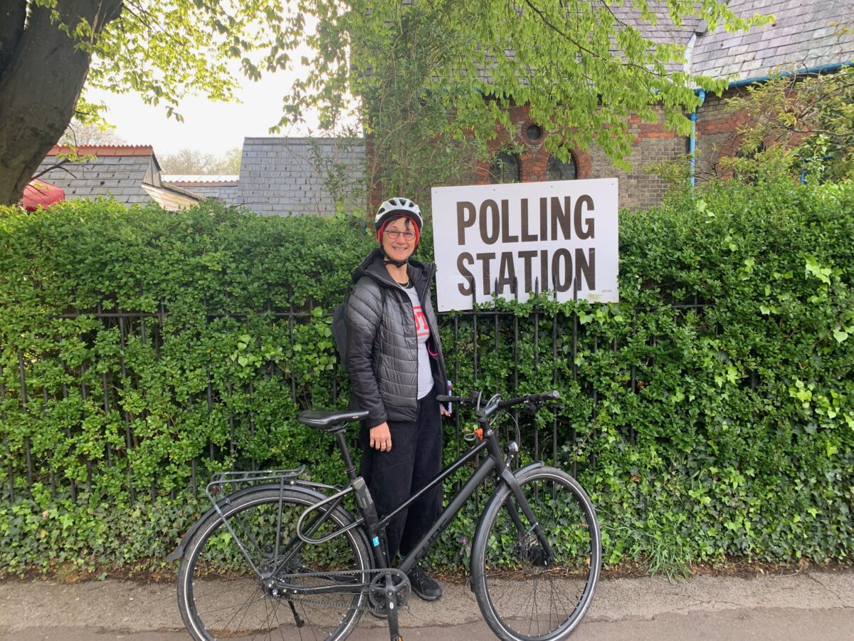 Katie and her bike outside a polling station in Petersfield