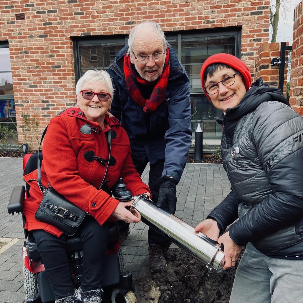 Gerri Bird, Richard Robertson and Katie Thornburrow with the steel time capsule